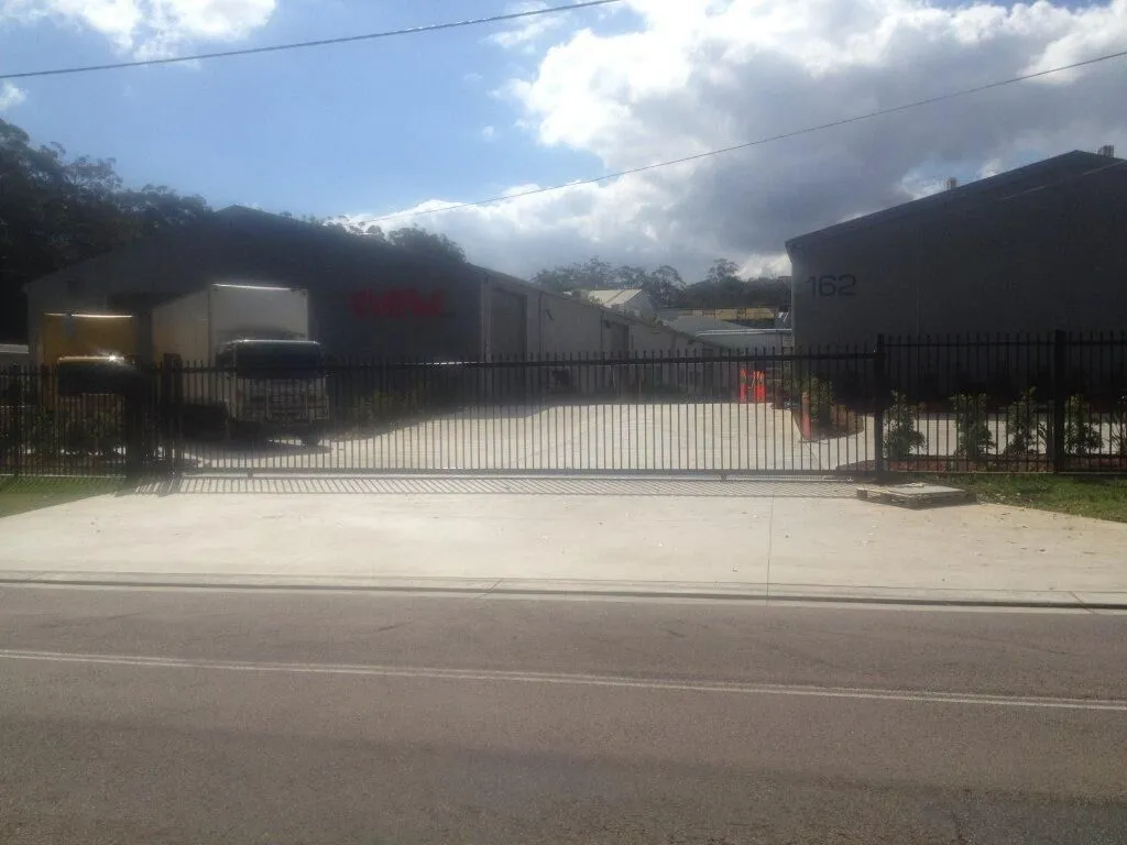 A 13.5 m wide by 2.1 m high fully automated remote-controlled sliding gate.