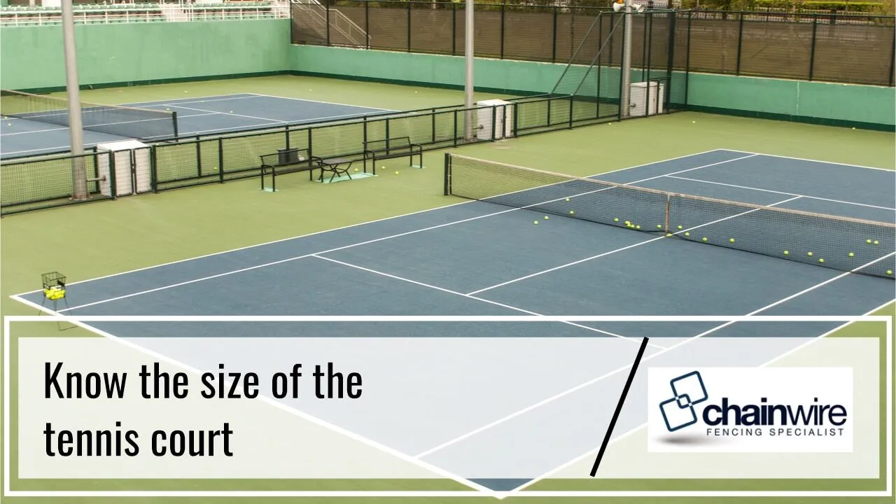 A chainwire fence enclosing a tennis court
