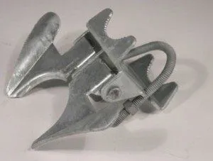 A close-up of a fork latch on a chainwire gate