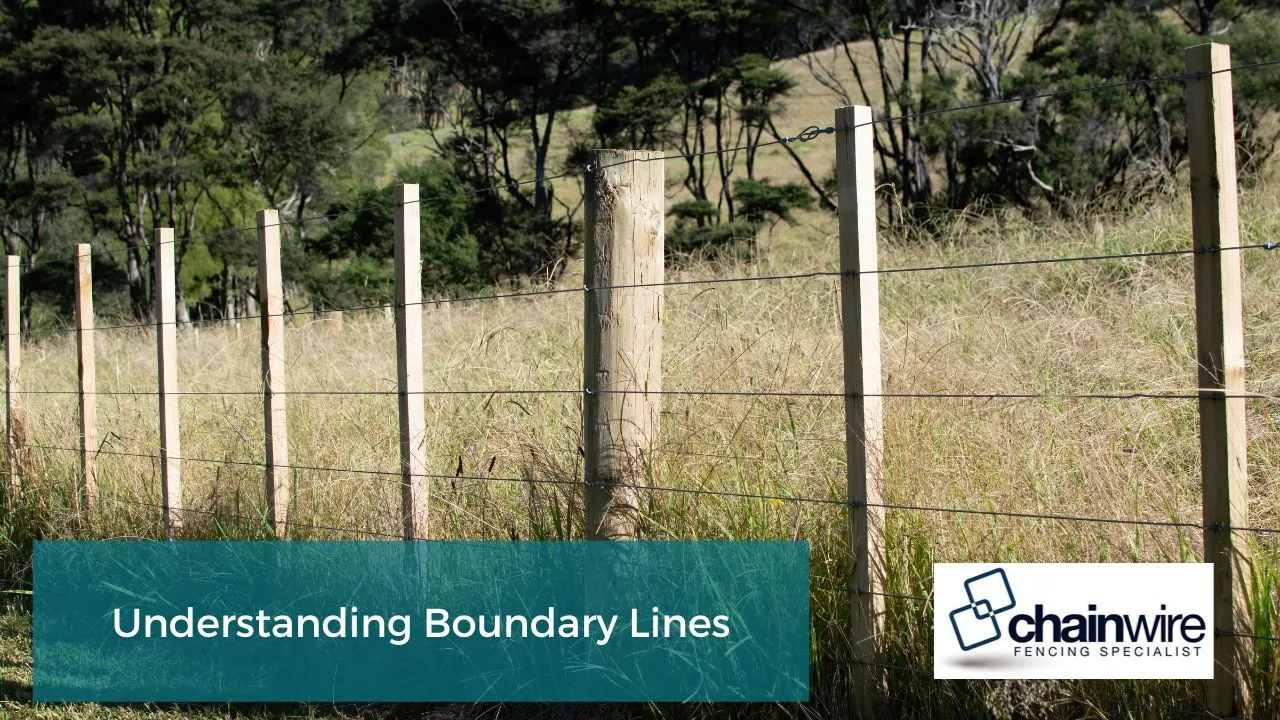 Two properties meeting at a marked boundary line with a dividing fence