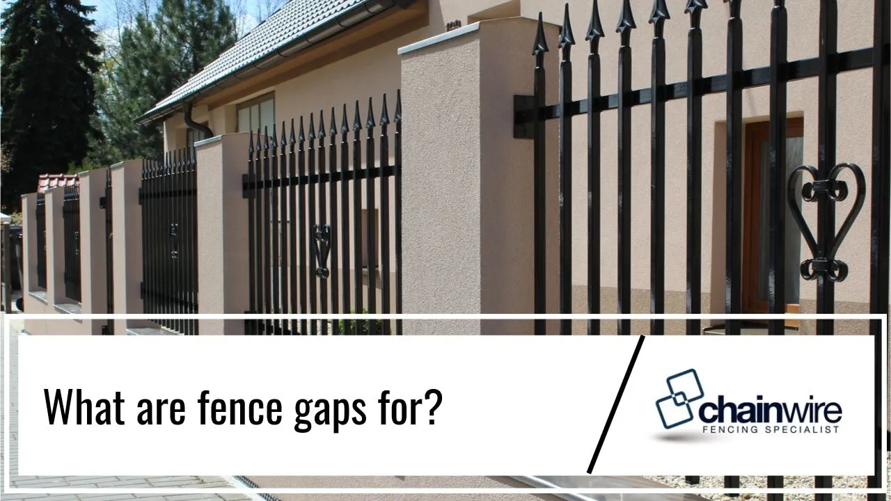 A fence line showing the spacing between boards and posts