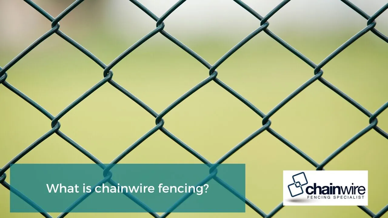 A galvanised chainwire fence showing the diamond mesh pattern