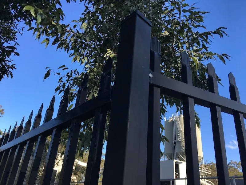 Black press-formed spear-top steel security fence