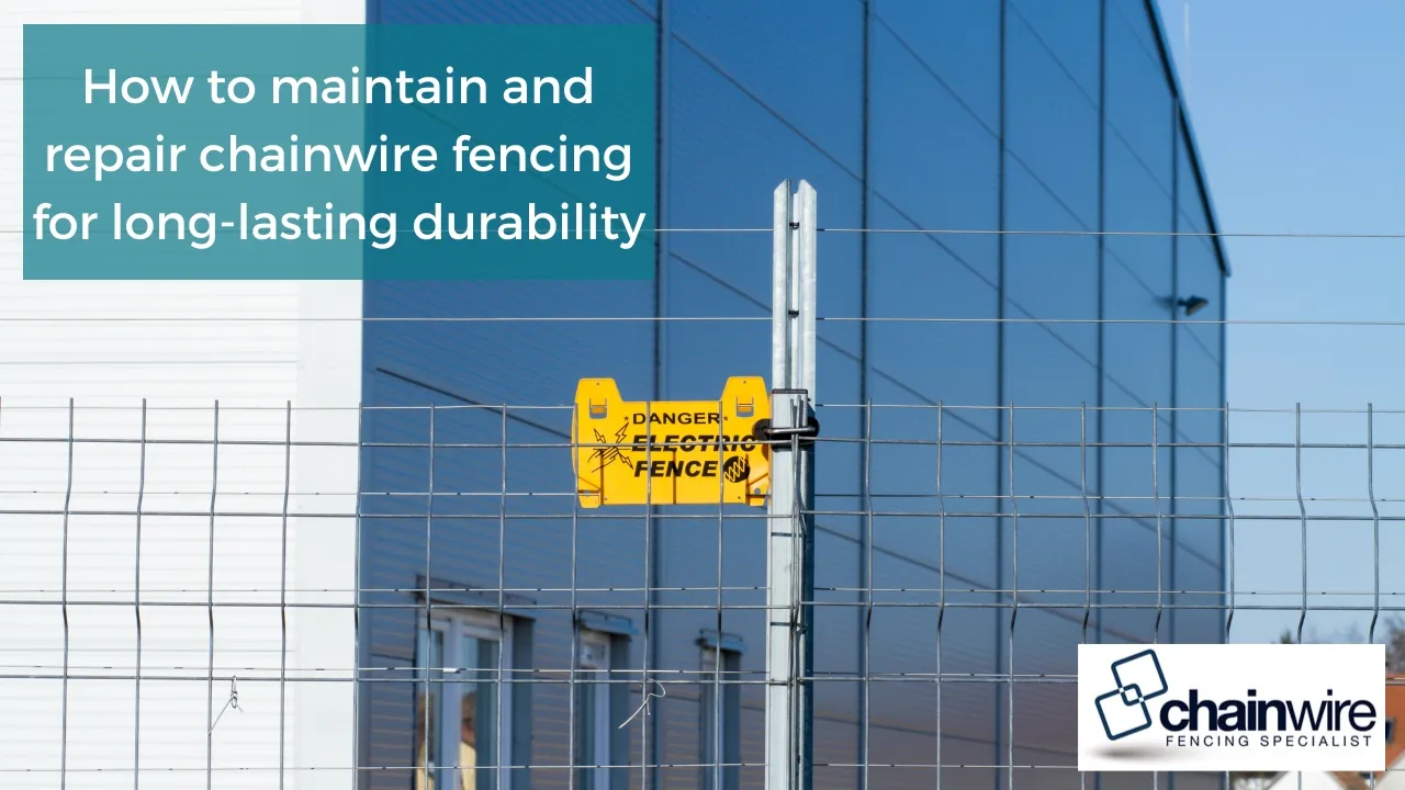 Worker inspecting and tensioning a galvanised chainwire fence line
