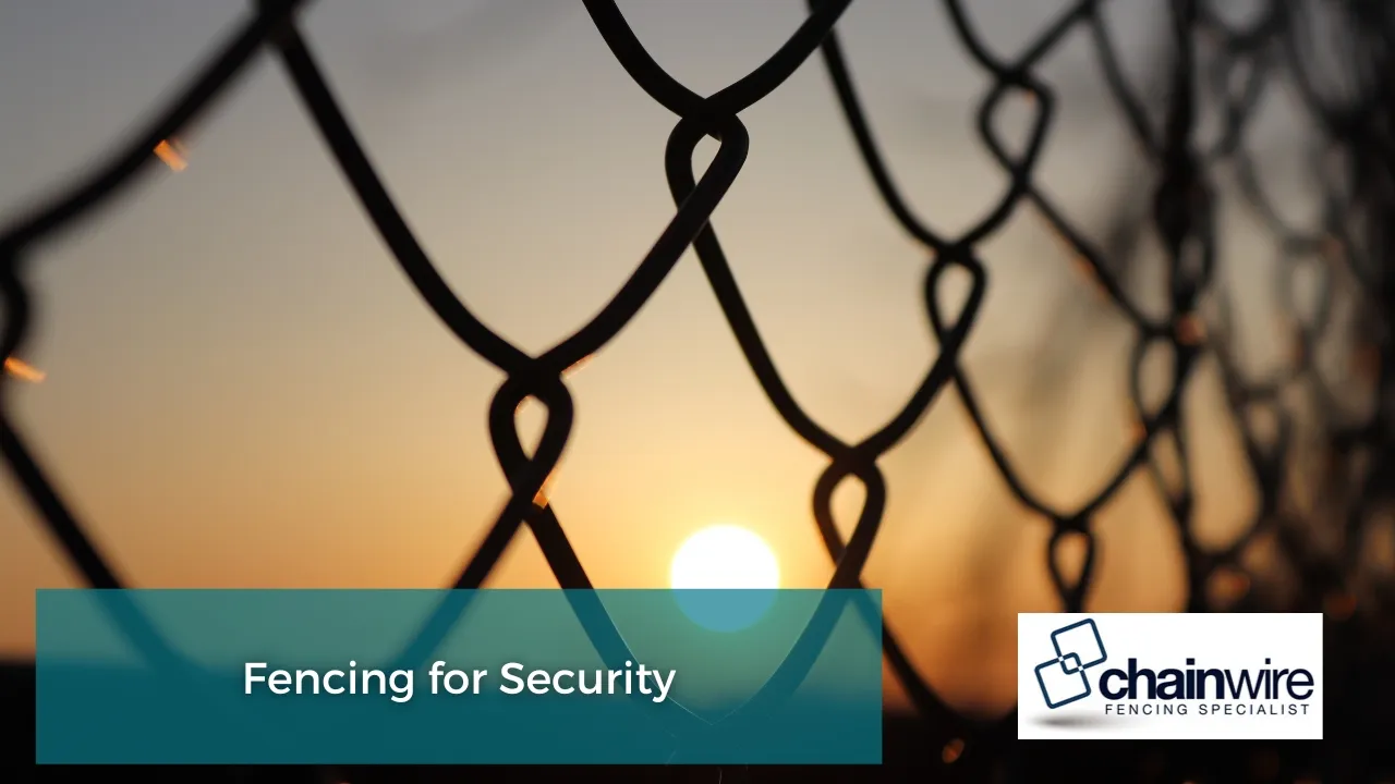 Chainwire and steel security fencing around a commercial yard