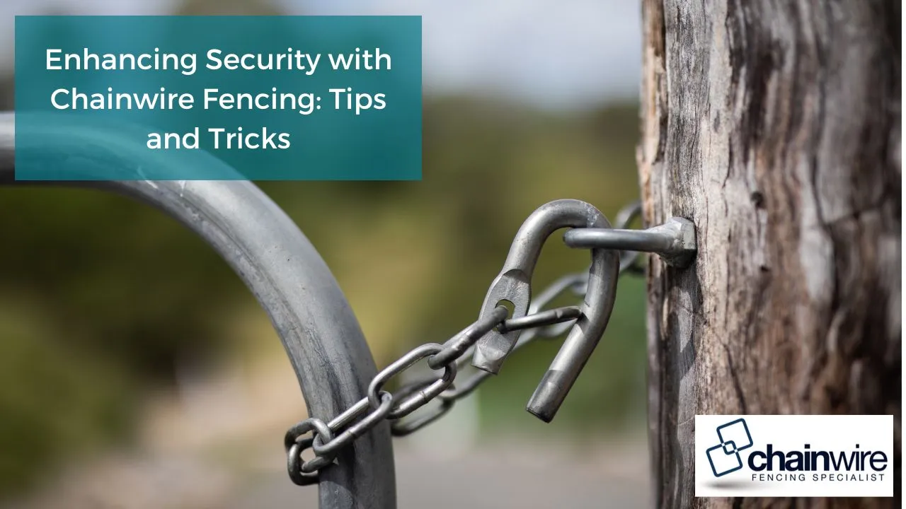 Galvanised chainwire security fence with barbed wire top and cranked posts around an industrial yard