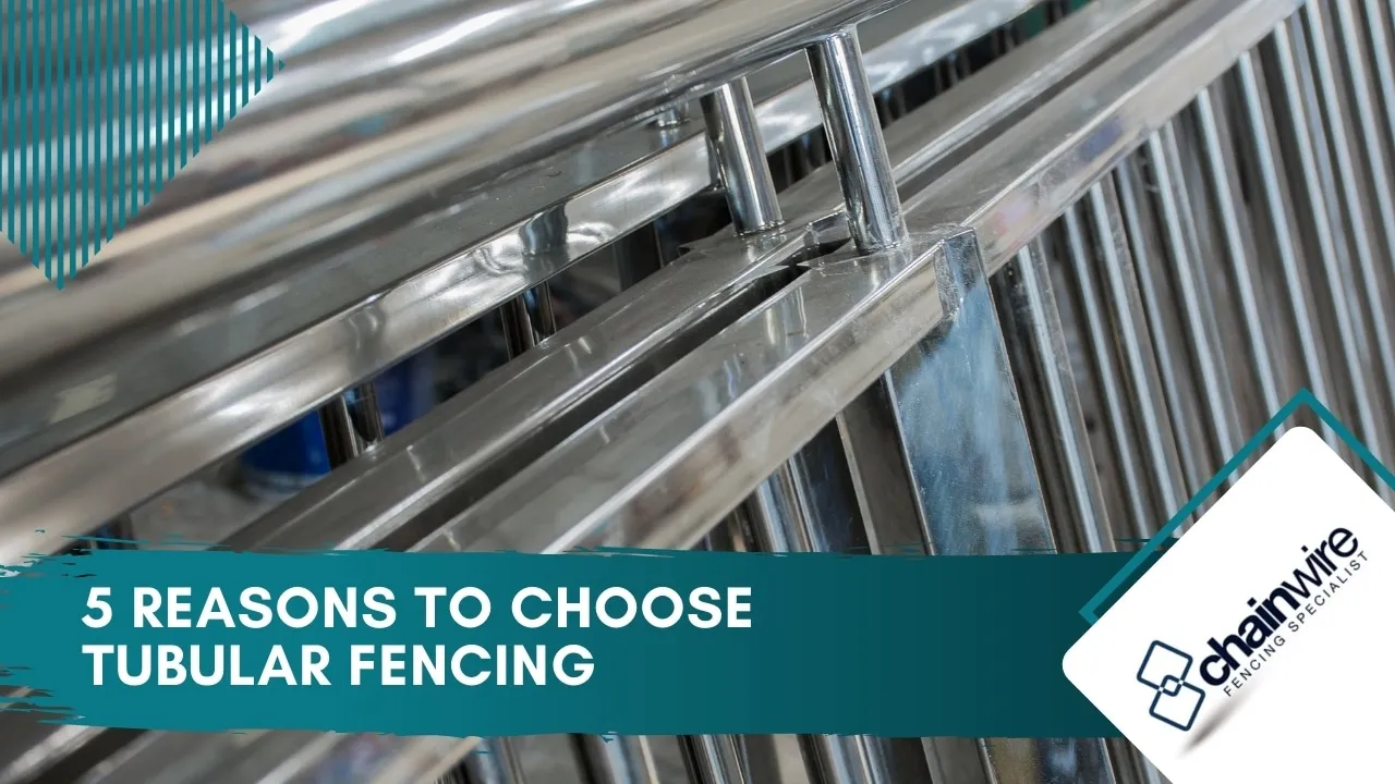 Powder-coated tubular steel fencing along a property boundary