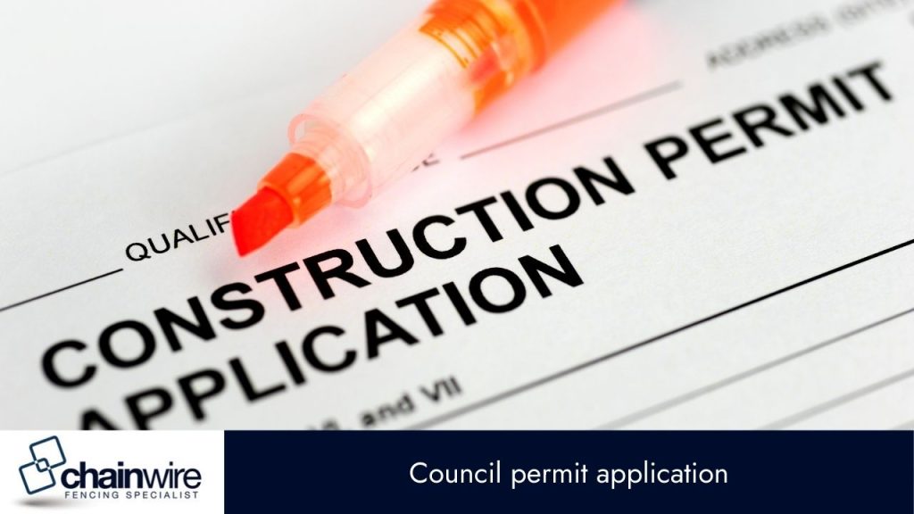 A close-up of a form titled "CONSTRUCTION PERMIT APPLICATION" with an orange highlighter marker resting on it. 