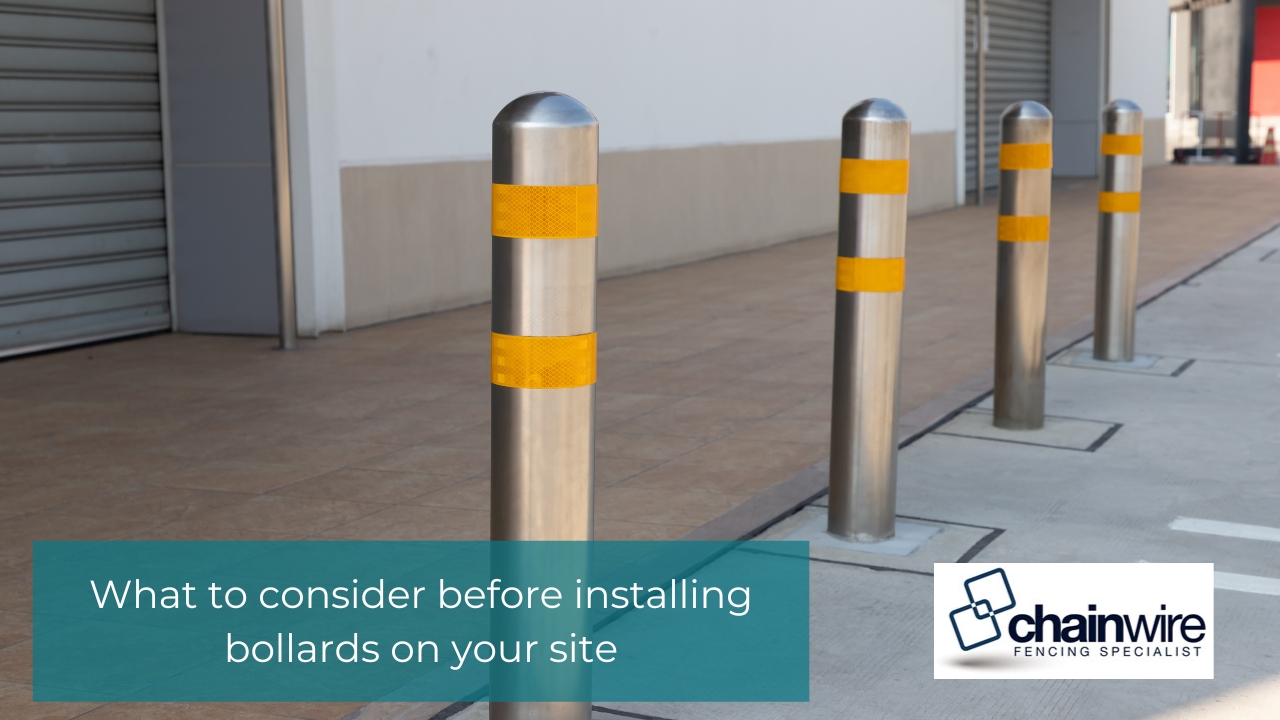 A Guide to Commercial Bollard Installation in Newcastle - Bollard Row of stainless steel safety bollards with yellow reflective bands installed on a concrete sidewalk